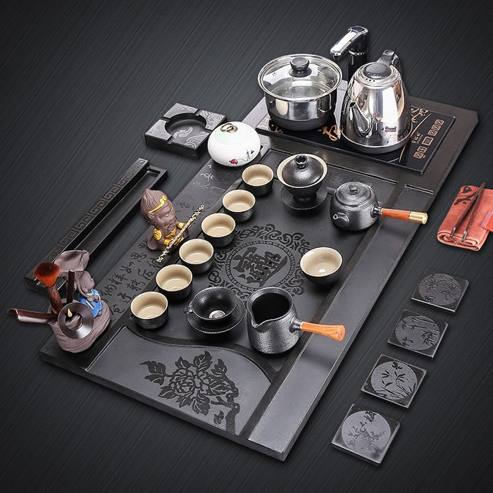 廠家直銷烏金石茶盤套裝 四合一設(shè)計帶電磁爐，家用茶臺定制新選擇